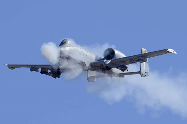 Fairchild-Republic Thunderbolt 2 (82-0663) - A-10C Warthog of the 357th Fighter Squadron Dragons based at Davis-Monthan Air Force Basefires its GAU-8 30mm cannon at a target on the Goldwater Bombing Range.