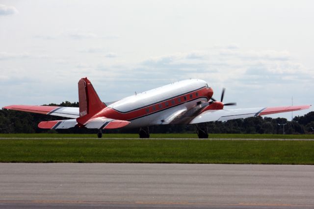 Douglas DC-3 (turbine) (N115U) - DC3 arrival to Beverly Regional Airport on 8/1/21.