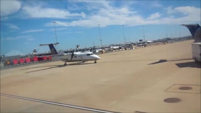 de Havilland Dash 8-200 — - Welcome to Dulles International on a Sunny Late-Morning, A United Dash 8 -200 sits parked on the Ramp waiting for her next flight, United's ENITRE Dash 8 Fleet was Retied in favor of buying more Embraers