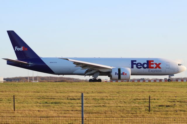 BOEING 777-200LR (N870FD) - A FedEx B777F slowing down after landing on runway 22 at STN.br /br /Location: Stansted Airport.br /Date: 26.12.22 (dd/mm/yy).