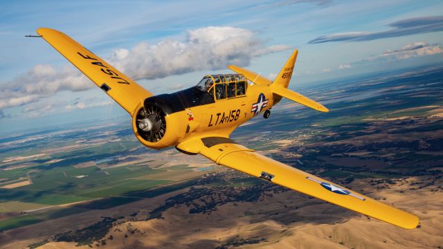 North American T-6 Texan (N158JZ) - "Miss Humboldt Hunny" over the Sacramento area. Photo credit and thanks to Mike Mainiero for the shot and Nick Coutches and Loren Marburg for getting this wonderful warbird into position. Additional thanks to the rest of the awesome people that worked on the photoshoot as well. Truly brought to life through the lens!