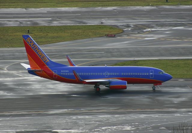 Boeing 737-700 (N499WN) - KBFI - (32481/1636) Jan 24th, 2005 this was then the last of the N499 series registrations for the 747-700 for SWA. This 737 using the rare general aviation taxi way headed to the take off point at Boeing Field. The delivery Pilots for this jet were on the Boeing 747 Tour with us on the day before.