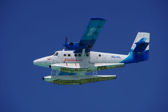 8Q-IAL — - A DHC Twin Otter over a resort in the Maldives