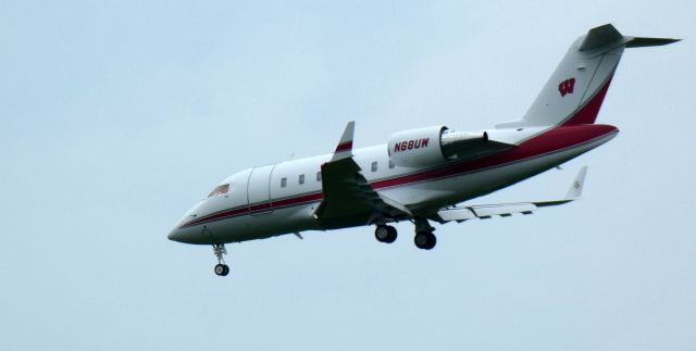 Canadair Challenger (N68UW) - About to touch down is this 2013 Bombardier Challenger 605 in the Summer of 2023. Go Wranglers!