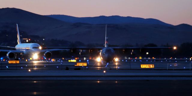 Lockheed C-130 Hercules (92-0549) - Handheld slow shutter photo taken at 8:04 PM from 4000 feet away.br /br /NevANG's "Roller Four Niner" is captured here as it is turning off Taxiway Alpha and entering the NevANG ramp via the ANG 1 entry point. Roller 4-9 had just arrived from Half Moon Bay (KHAF) in California.br /br /Data .....br /Time: 8:04 PM (final moments of evening dusk light)br /Shutter: 1/13th of a secbr /ISO: 1600br /F-stop: f/5.6br /Distance: 4000 feetbr /br /If the Fed Ex B752 had not had its headlight on as it was taxiing behind the Hercules, I could not have gotten this shot. The nose gear headlight on the FDX freighter provided just enough light to illuminate the gray C-130 as it was turning.