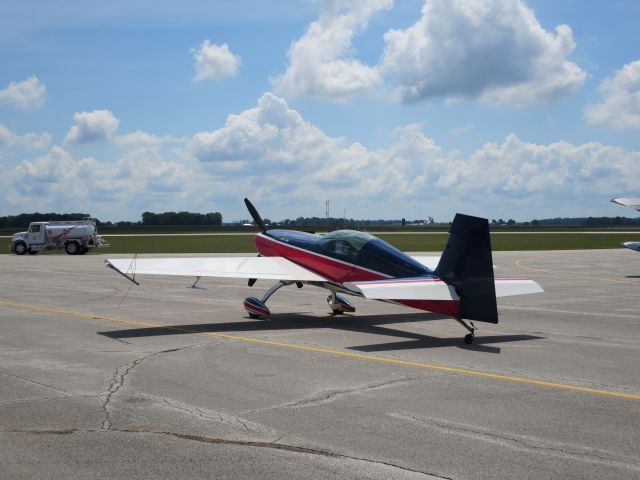 Piper Cherokee (N948J) - Mitch Wilds Extra 300S at Kokomo Airshow 7-23-16