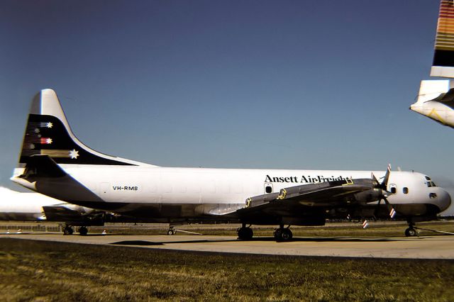 Robinson R-44 (VH-RMD) - ANSETT AIR FREIGHT - LOCKHEED L-188A ELECTRA - REG : VH-RMB (CN 1047) - TULLAMARINE MELBOURNE VIC.. AUSTRALIA - YMML 7/5/1984 35MM SLIDE CONVERSION USING A LIGHTBOX AND A NIKON L810 DIGITAL CAMERA IN THE MACRO MODE.