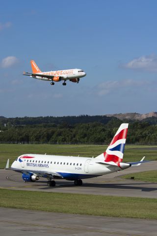 Embraer 170/175 (G-LCYH) - G-EZBM landing behind.