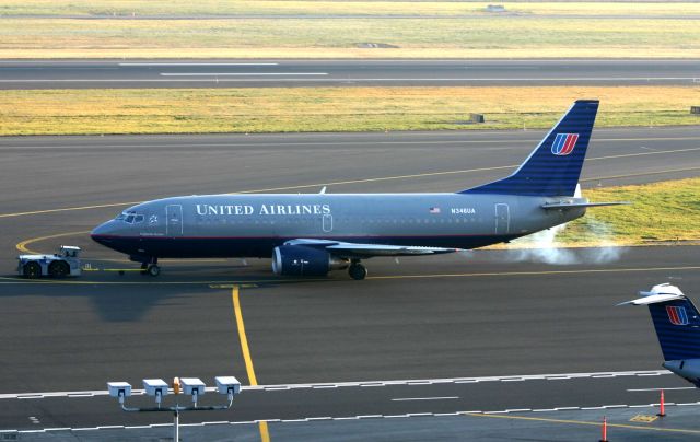 BOEING 737-300 (N346UA) - KPDX- early morning smoky start-up for this UAL 737 at Portland. This is one nice airport to film at - on a clear day!