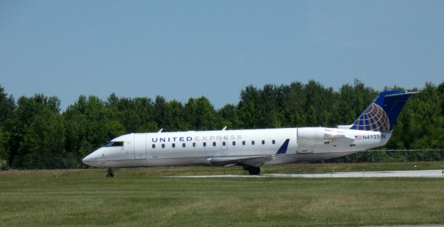 Canadair Regional Jet CRJ-200 (N492SW) - Taxiing to parking is this 1997 United Express Canadair Regional Jet 200LR from the Spring of 2021.