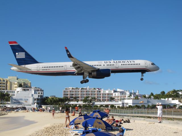 Boeing 757-200 (N941UW) - This United Boeing 757 completes his approach for landing in Sint Maarten's Princess Juliana Airport on Feb 5, 2010.