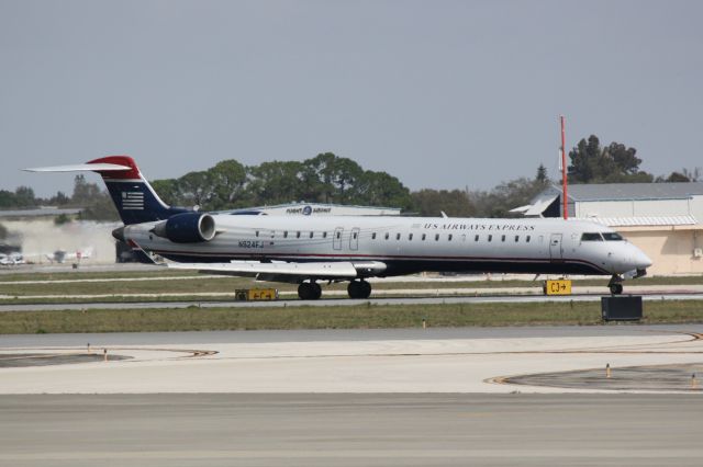 Canadair Regional Jet CRJ-900 (N924FJ) - Mesa/US Air Flight 2607 (N924FJ) arrives on Runway 14 at Sarasota-Bradenton International Airport following a flight from Charlotte/Douglas International Airport