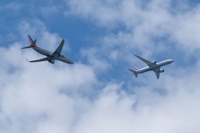 Boeing 737-800 (N803NN) - The 737 is turning final for the west side runways, the 787 is on a base leg for the east side runways