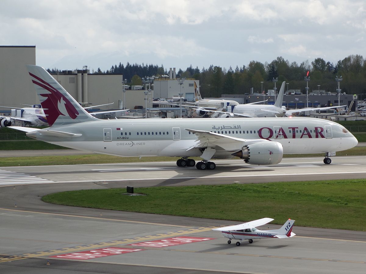 Boeing 787-8 (A7-BCU) - Double beacon! A tiny Cessna 172 holds short while A7-BCU throttles up for takeoff on a test flight.