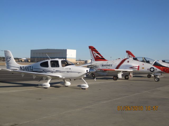 Cirrus SR-22 (N346TJ) - Cirrus SR22 Parked next to a bunch of military trainers.