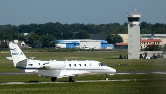 Cessna Citation Excel/XLS (N844JS) - Taxiiing for the departing runway is this 2003 Cessna Citation Excel 560XLS from the Summer of 2021.