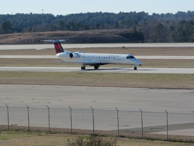 Embraer ERJ-145 (N571RP) - Delta Connection (Shuttle America) flight 5883 to Indianapolis Intl, an Embraer ERJ 145 taxiing to takeoff on runway 23R. This was taken January 30, 2016 at 3:39 PM.