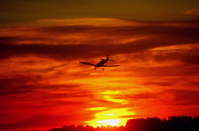 PZL-MIELEC Dromader — - Taken back in June.  This is not photoshoped, it is the actual Air Tractor dusting a Corn Field during sunset