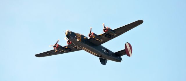 Consolidated B-24 Liberator (N224J) - While riding my mountain bike at the former South Weymouth Naval Air Station, the Collings Foundation B-24 Witchcraft flew over. 