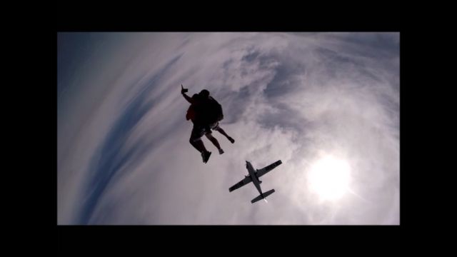 — — - From my 8/5/2015 Skydive at "Skydive Myrtle Beach" located at Grand Strand Airport (KCRE) in North Myrtle Beach, SC Im just out the Door of Cessna 208 at 14,000 Feet. Thanks to my Instructor Alex Torre and Videographer Yanni Lee of "Skydive Myrtle Beach" in making my Jump a truly memorable event, my Nirvana! Look at this view, as seen from Videographer Yanni Lees Camera who is free-falling BELOW us, the Cessna Caravan 208 is silhouetted against the Sun and both Yours Truly and Mr. Torre are free-falling prior to Main Parachute opening.