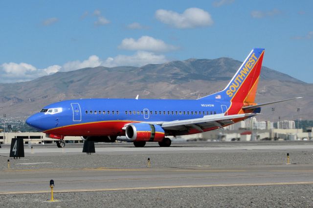 Boeing 737-700 (N524SW) - Reversing thrust after landing on runway 16L.