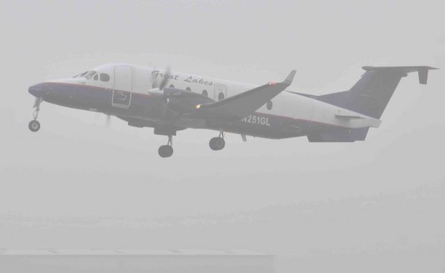 Beechcraft 1900 (N251GL) - visibility is 1/4 mile