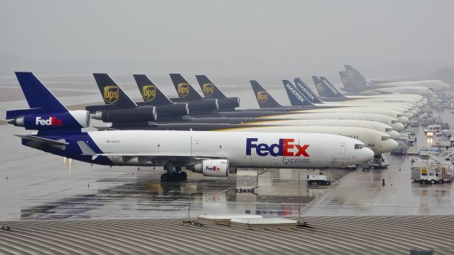 Boeing MD-11 — - Cargoramp @CGN on a rainy day