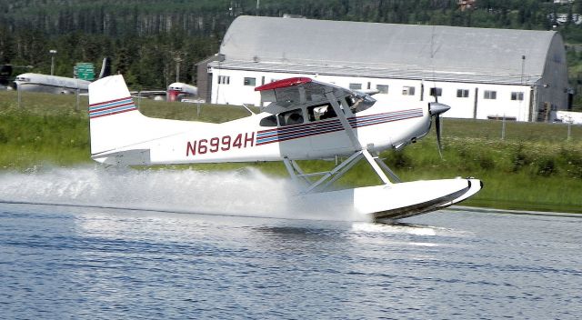 — — - Hanging on. Notice the passenger on the right side of the pilot hanging on.