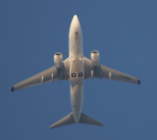 Boeing 737-700 (C-GWBX) - Flying overhead at Laird and Eglinton, Toronto