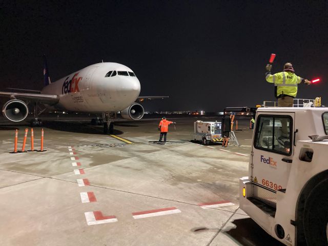 Airbus A300F4-600 (N744FD) - Marshaling Flight 325 from Fargo ND on a warmer Appleton winter night. 