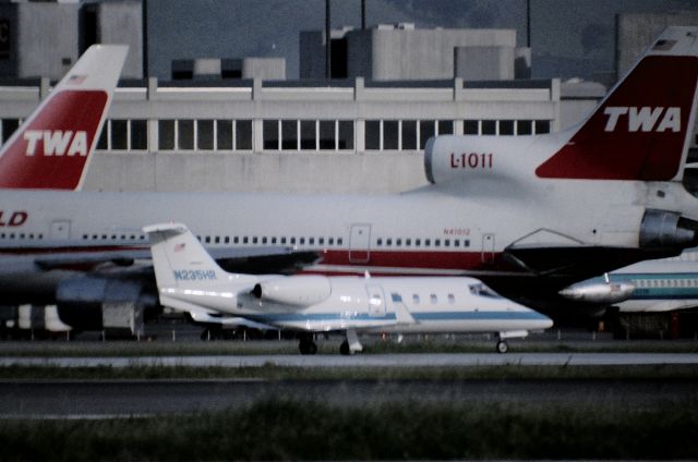 Learjet 35 (N235HR) - KSFO - 1000mm lens shot from Millbrae Airpark (handheld)