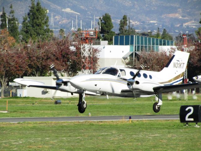 Cessna 421 (N31KT) - Taking off RWY 26L