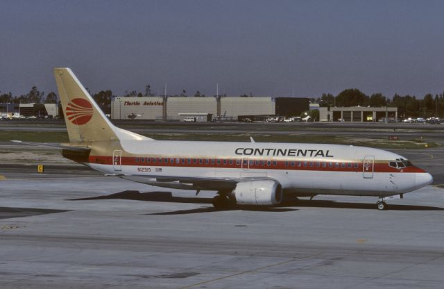 N12319 — - SCAN of Kodak 64 Slide - Continental Airlines at John Wayne Airport - 1991-03-07.