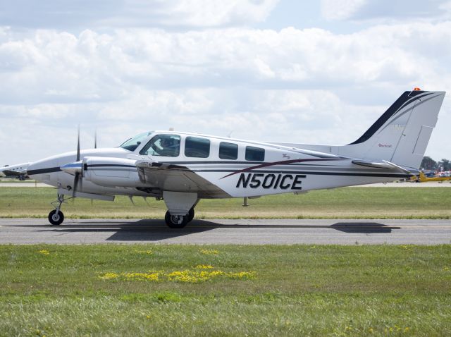 Beechcraft Baron (58) (N501CE) - A very nice Baron. Oshkosh 2013!