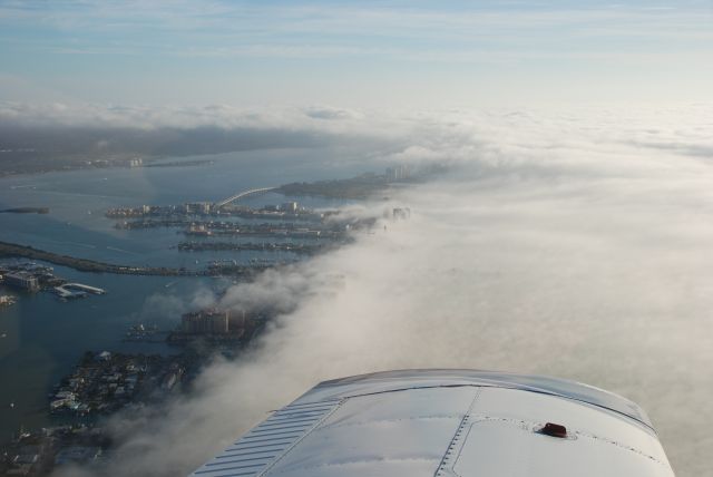 Piper Saratoga (N32VE) - Fog rolling in over Clearwatr Beach, FL