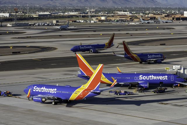 Boeing 737-700 (N242WN) - Welcome to Phoenix... N242WN Pushed, N8914Q At Gate, N436WN Taxing out and N8778L Taxing in