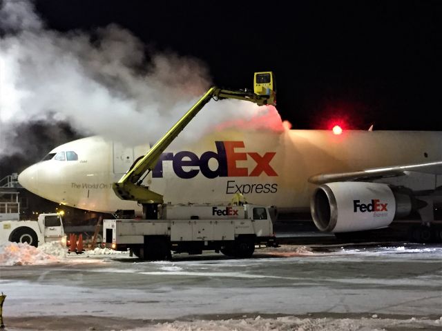 Airbus A300F4-600 (N671FE) - Airbus 300-6F "Caleb" getting a heavy dose of Type 1 Deicing Spray on the top of the fuselage.br /5 F temperatures but fortunately little wind.   