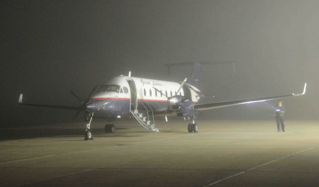 Beechcraft 1900 (N219GL) - First Office making his pre-flight inspection in the early morning for at Merced Regional Airport