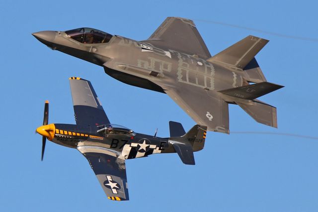 Lockheed F-35C (11-5038) - Jim Beasley, Jr. in his P-51D Mustang “Bald Eagle” (N51JB, c/n 44-73029-A) and a USAF Lockheed F-35A Lightning II (11-5038, c/n AF-49) from the ACC Demo team during the Friday evening twilight Heritage Flight performance.