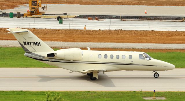 Cessna Citation CJ2+ (N417MH) - N417MH taxis down Alpha toward runway 22 as the new taxiway Alpha is being built (above).