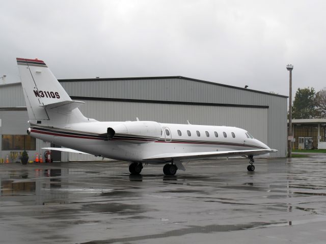 Cessna Citation Sovereign (N311QS) - Netjets. A rainy and windy day at the Niagara Falls.