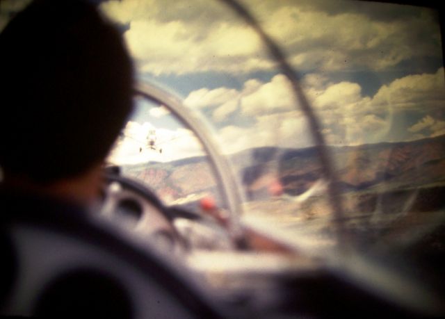— — - The towplane is right ahead of us, pulling the glider away from the Aspen airport.
