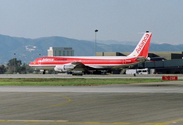 Boeing 707-100 (HK-2016) - KLAX - March 1989 shows an Avianca 707 rolling to the gate after landing 25L - this photo taken from the old Imperial terminal parking lot. 