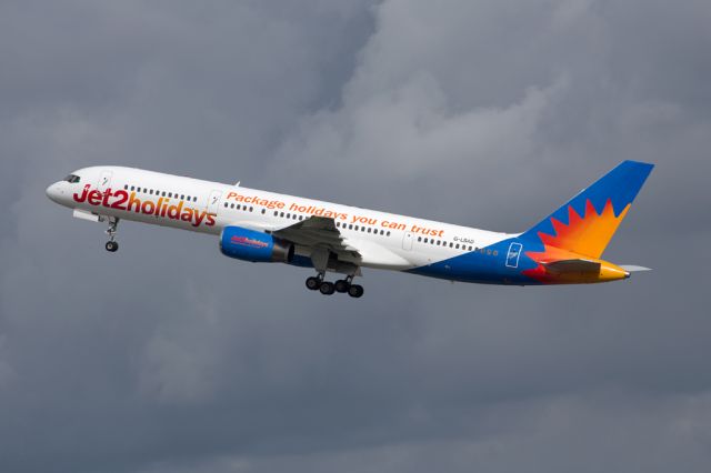 Boeing 757-200 (G-LSAD) - EXS803 departing for Barcelona against a cloudy sky