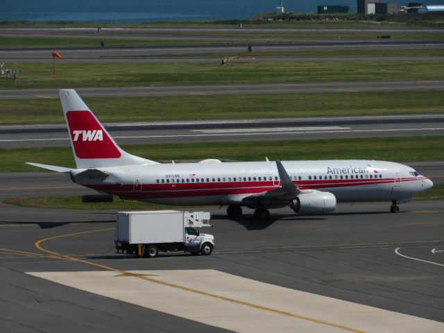 Boeing 737-800 (N915NN) - Americans TWA Heritage livery Taxies by the old American terminal at logan airport.