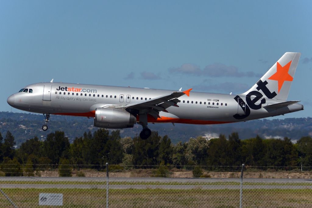 Airbus A320 (VH-VQM) - About to put down on runway 05. Monday, 14th April, 2014.