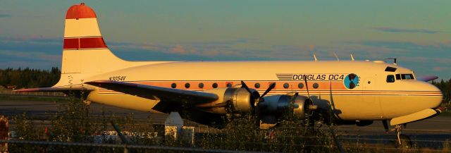 — — - Beautiful setting suns colors on a C-54 Skymaster.