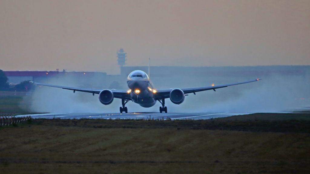 BOEING 777-300 (F-GSQP) - After the rain.Take off runway 24/06.
