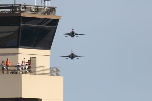 Lockheed F-16 Fighting Falcon — - The unsuspecting! As part of the show a pair of Thunderbirds buzz the tower at high speed. The people on the catwalk never heard them coming until they are hit by the incredible burst of sound! It's pretty funny to see it coming and knowing what's going to happen. Questions about this photo can be sent to Info@FlewShots.com