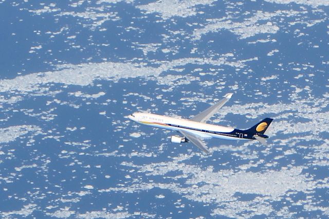 — — - Over the Atlantic approaching Canada from UK. Canon EOS 5 70-200 2,8 lens - crop from just maybe 15% of image